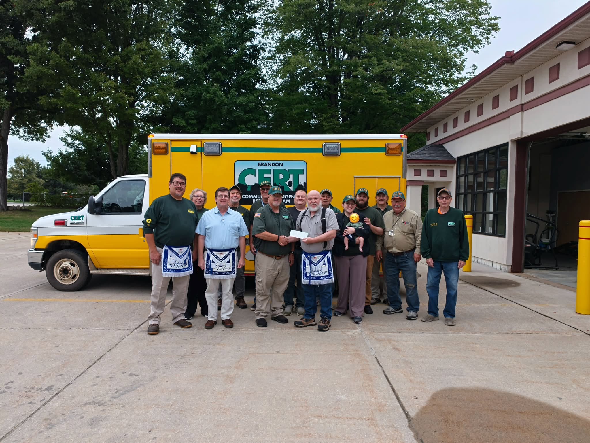 Roosevelt Lodge members presenting a donation to Brandon CERT beside the team vehicle