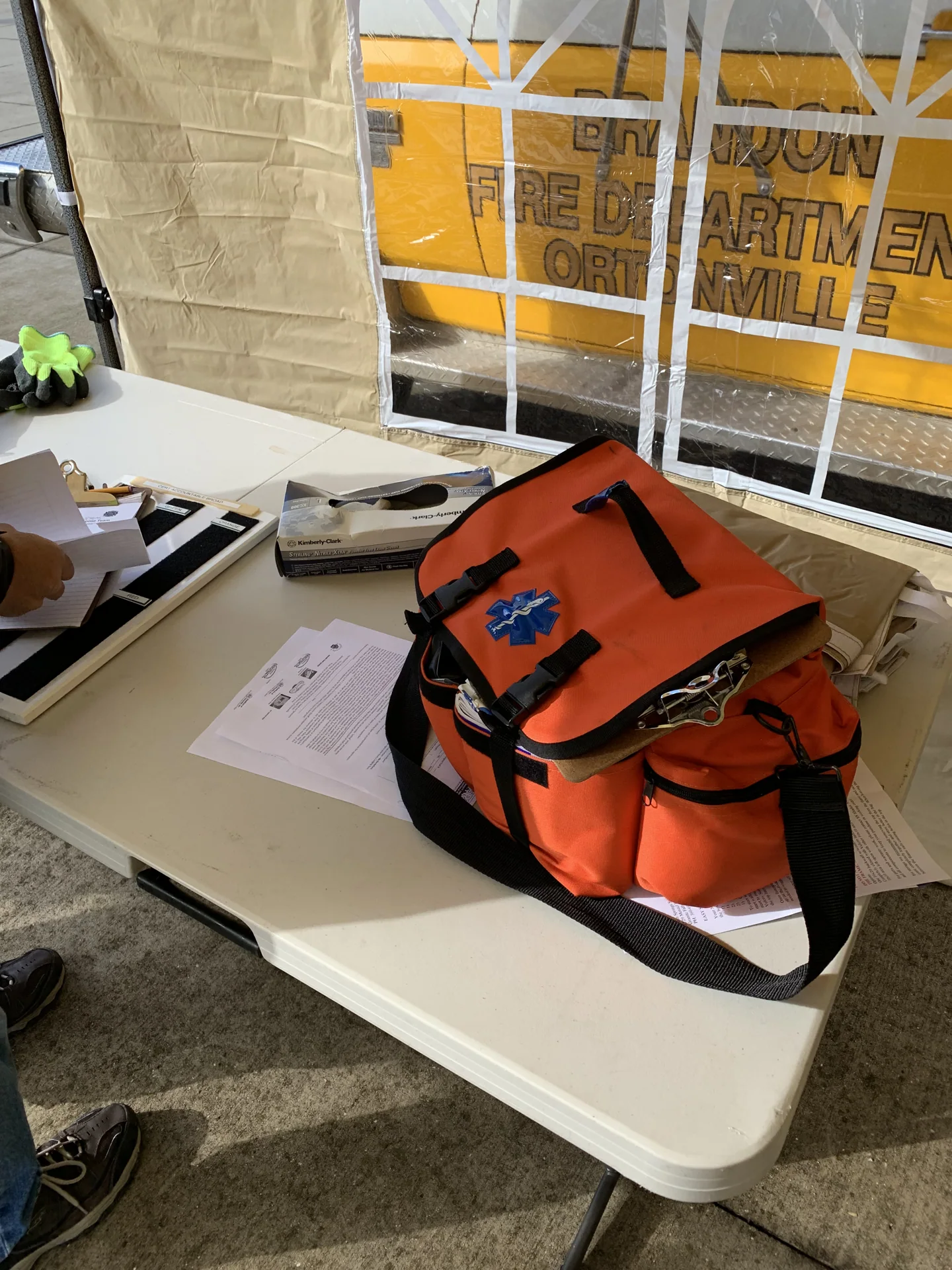 Orange equipment bag and supplies inside the CERT event tent